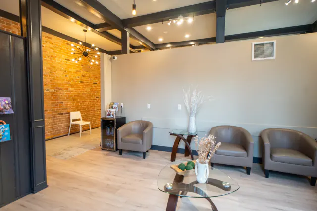 Dental clinic waiting room with exposed brick details in Cookstown