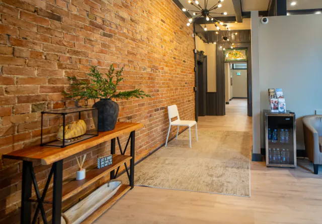 Welcoming entry hall with exposed brick at My New Teeth