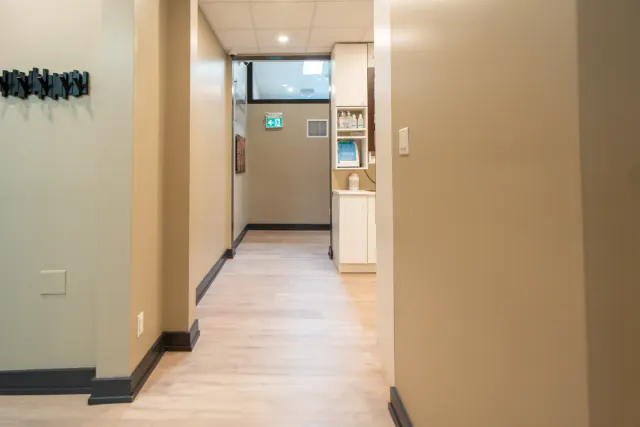 Bright hallway leading to the dental treatment area