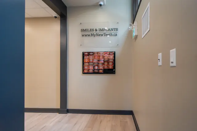 Smile and dental implant results display at My New Teeth