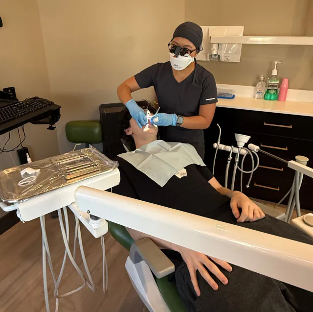 Dental hygienist performing a patient checkup at My New Teeth