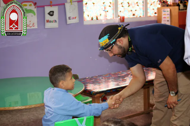 My New Teeth dentist greeting a child during a community outreach visit