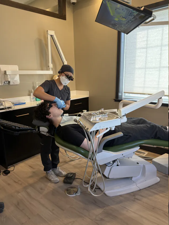 Dental hygienist caring for a patient at My New Teeth in Cookstown