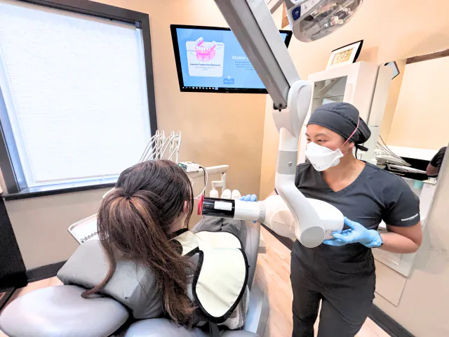 Dental assistant taking a digital X-ray at My New Teeth