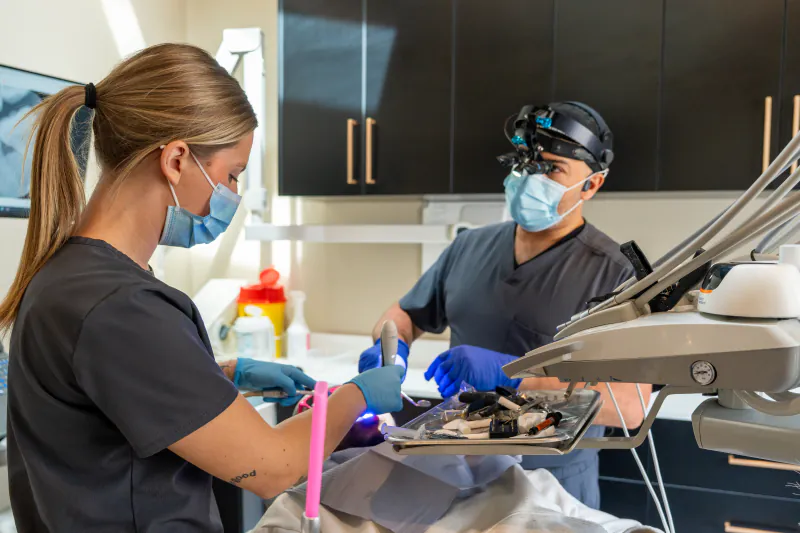 A dentist and dental assistant providing treatment at My New Teeth in Cookstown